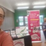 Volunteers at an event stand