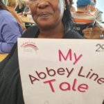 Person holding up a sign
