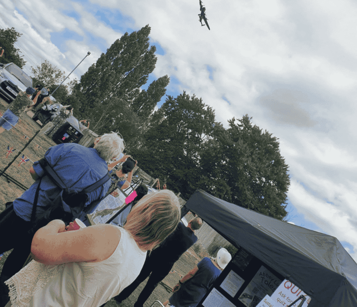 People watching an airplane flyover