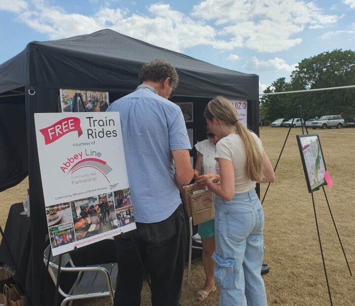 People at a festival stall