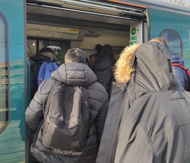 Students getting on a train