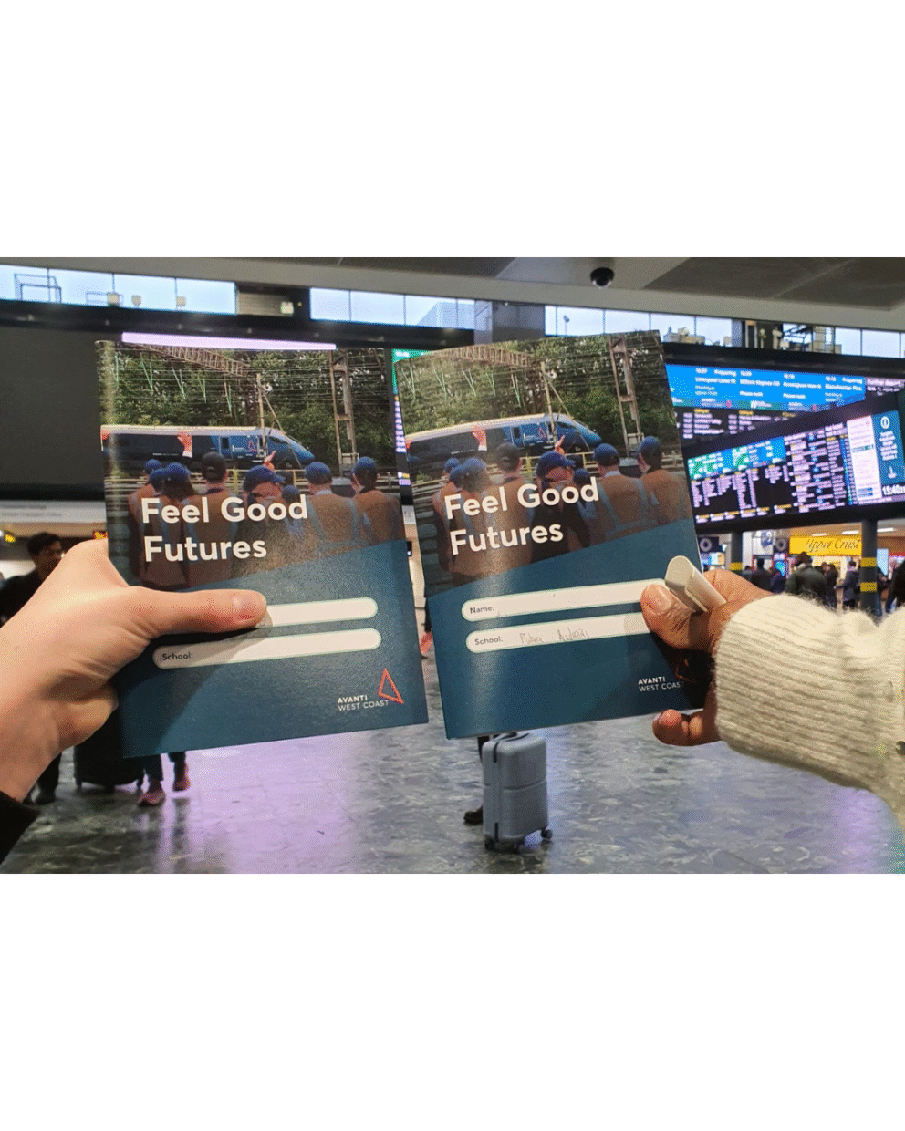 Students holding up activity books Feel Good Futures