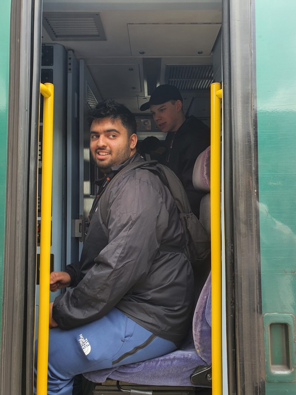 A young person on a train