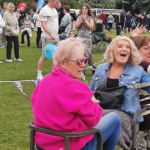 People laughing on a mini-train