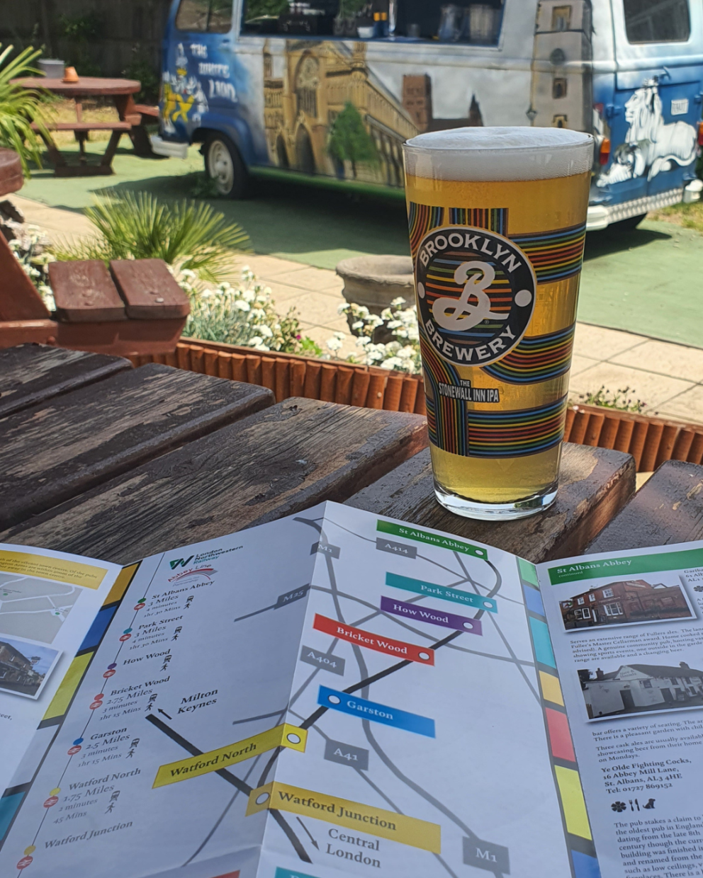 A beer garden with a pint of beer and a Rail Ale Trail leaflet