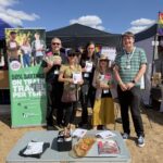 People in front of a festival stall