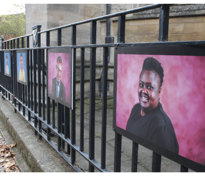 An outdoor portrait exhibition on railings